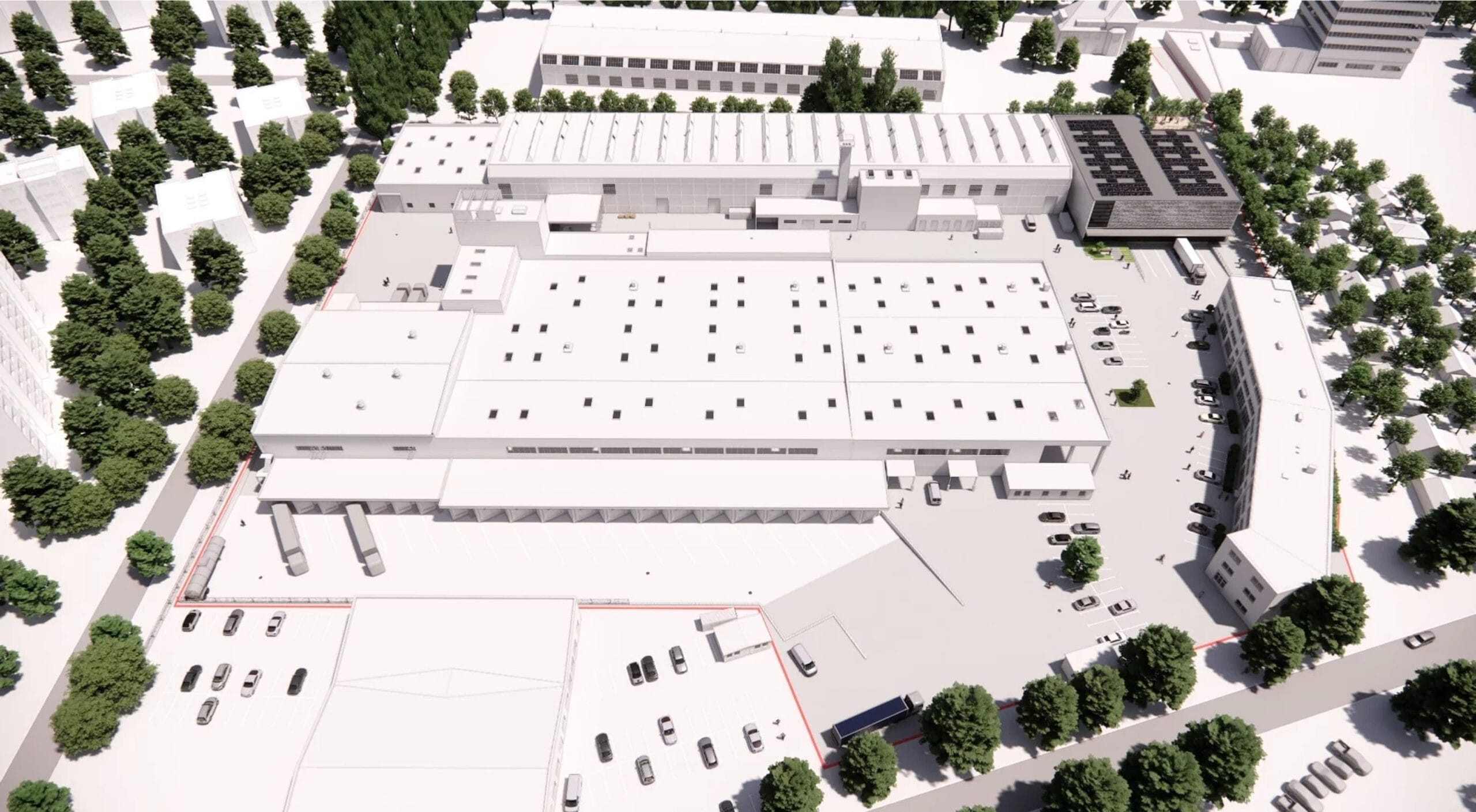 Luftaufnahme eines weißen Fabrikgebäudes